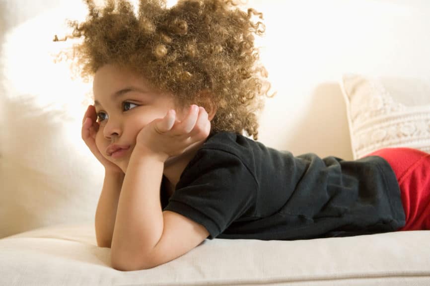 bored boy laying on couch