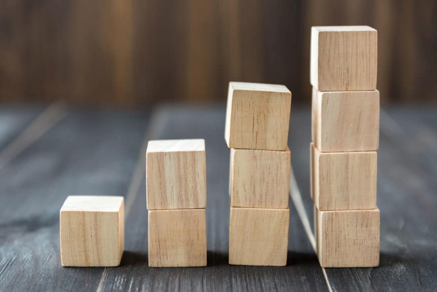 Close-Up Of Stacked Wooden Blocks On Table