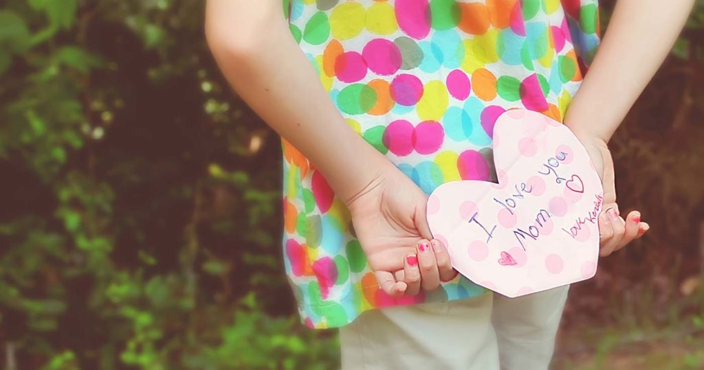 girl holding letter