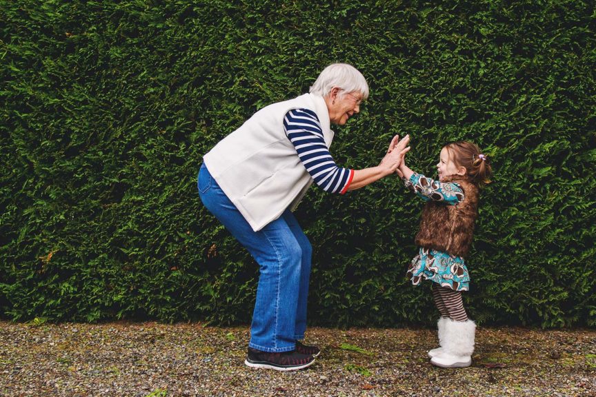 girl playing with grandmother volunteer excitement