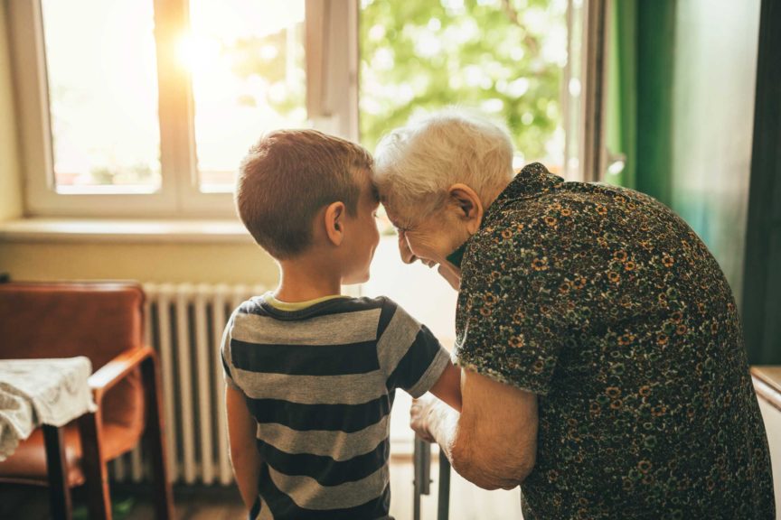 Grandson visiting his granny in nursery