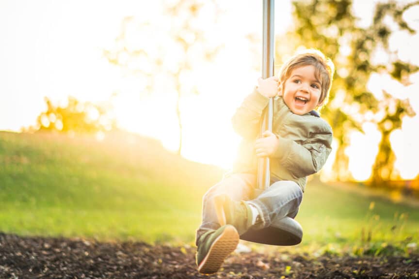Happy boy on a swing