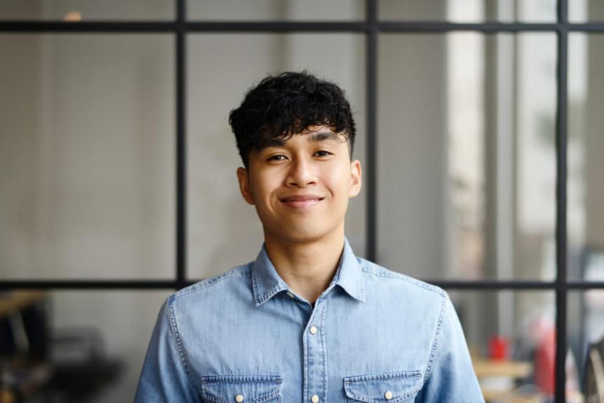 Portrait of a young man in a modern office