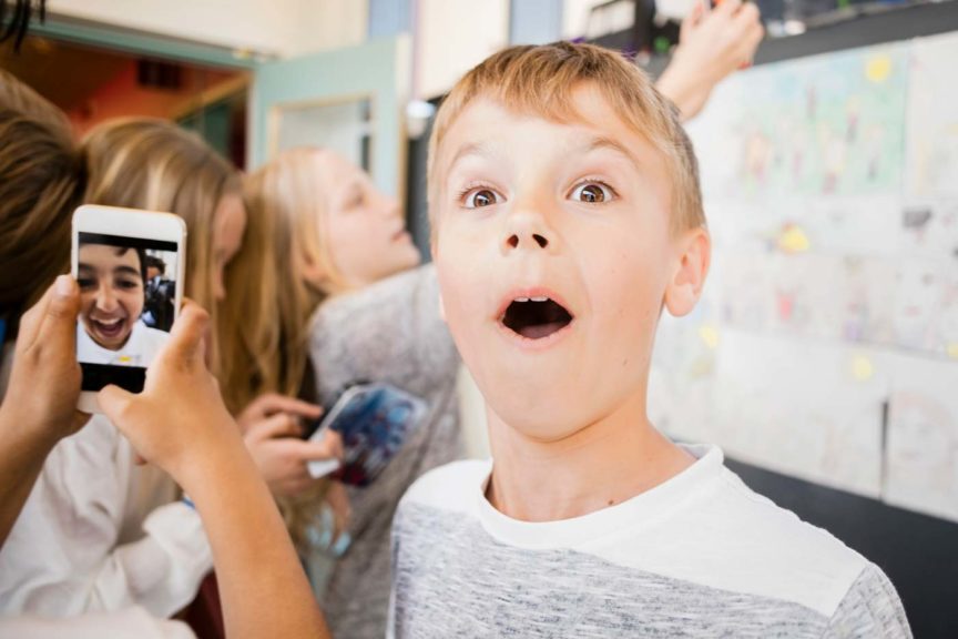 surprized-boy-taking-selfie-friends
